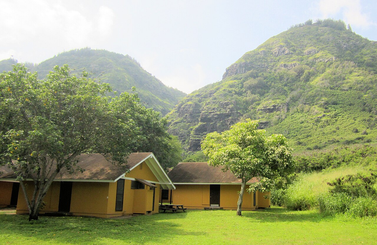 DHARMA houses in a mountainous setting.