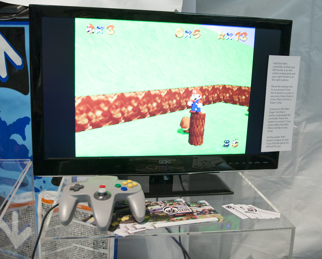 Super Mario 64 running on a display with an N64 controller.