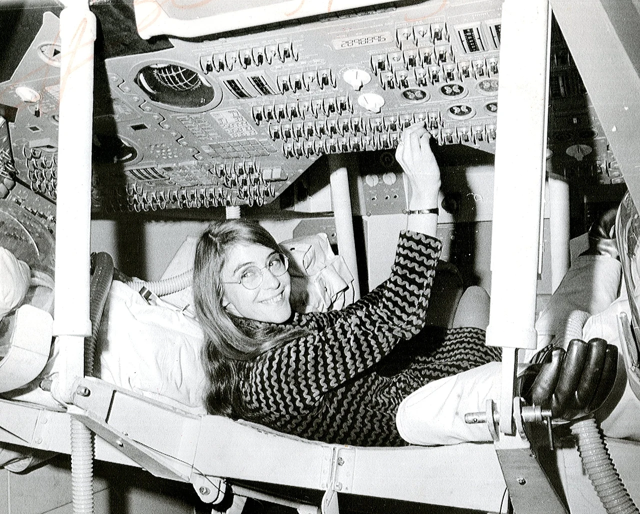 Margaret Hamilton inside an Apollo command module simulator.