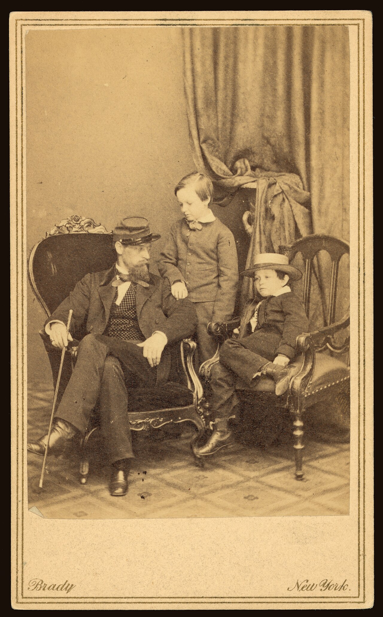Willie and Tad Lincoln with Lockwood Todd in Mathew Brady's studio, 1861.