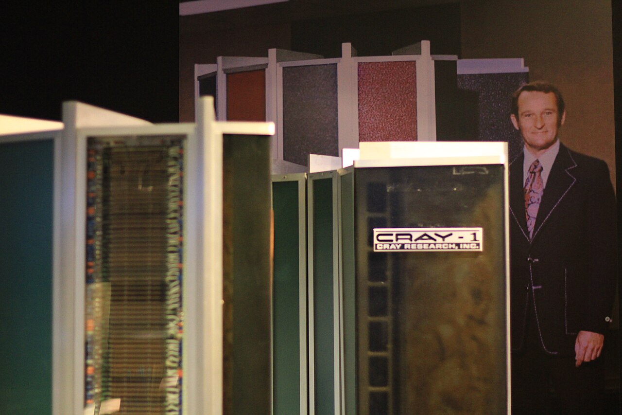 Seymour Cray pictured in a display alongside a Cray-1 supercomputer.