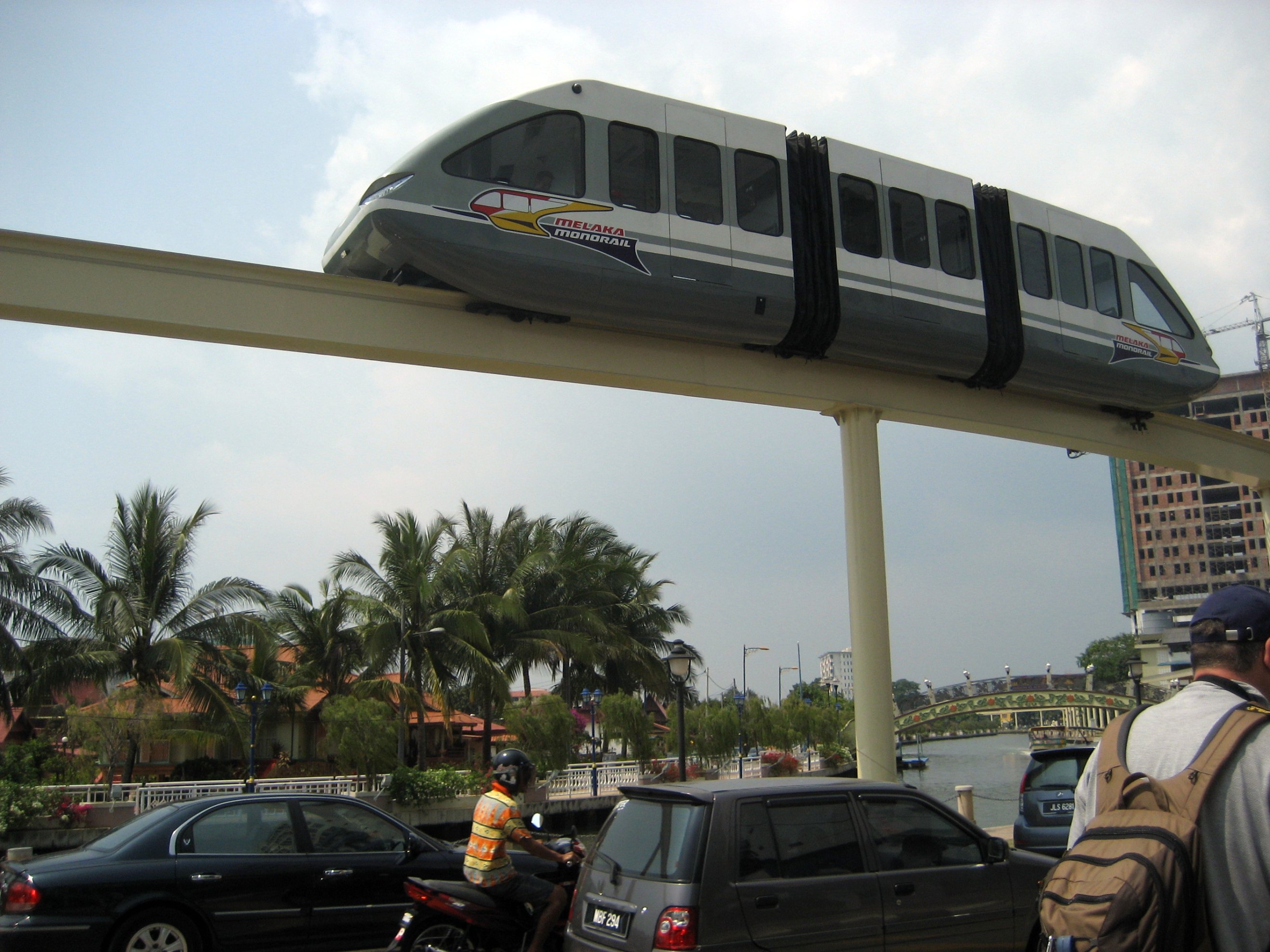 Melaka Monorail train operating near the river.