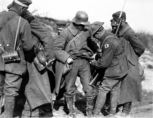 Australian soldiers searching German prisoners of war in October 1918.