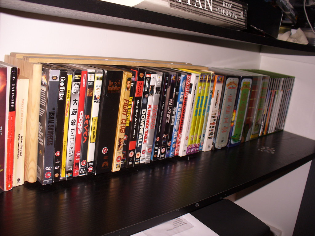 DVD cases arranged on a shelf, including Fight Club.