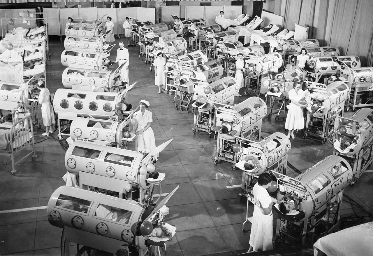 An iron lung hospital ward staged circa 1953.