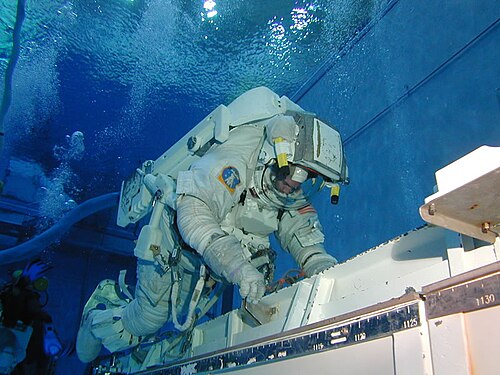A shuttle astronaut trains in the Neutral Buoyancy Laboratory.